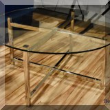 F12. Round glass top and chrome coffee table. 